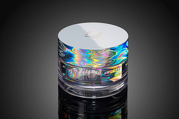[Translate to Française:] Cosmetic jars with rainbow hologram effects